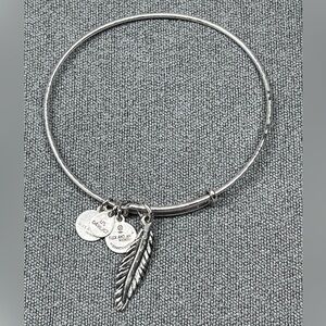 Alex and Ani silver tone bangle bracelet with feather charm.